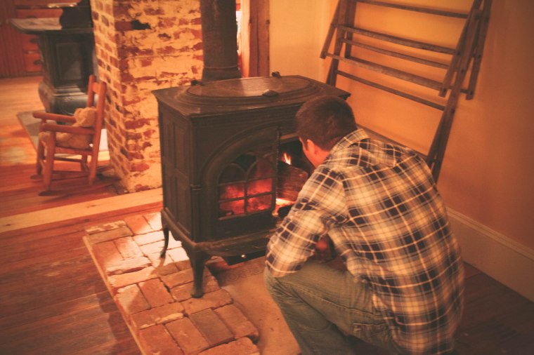Chef making a fire for the night.  